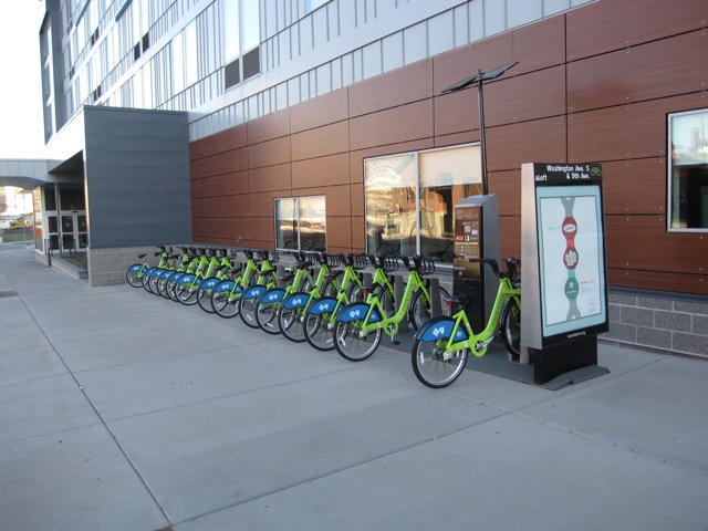 a row of bicycles parked in front of a building