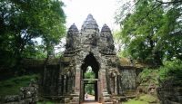 a stone structure with a face carved into it