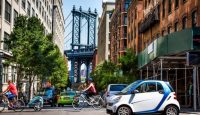 a group of cars and bicycles in a city