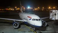 an airplane on the runway at night