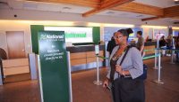 a woman standing in a check-in counter