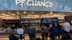 a group of people sitting at a bar