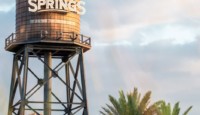 a water tower with a sign on it