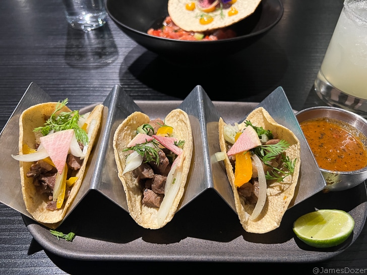 a group of tacos on a tray