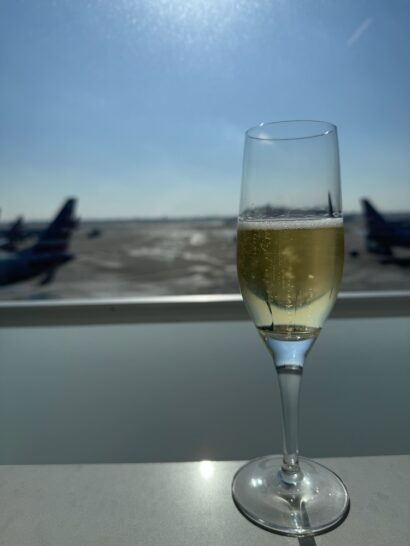Some champagne in the American Airlines Flagship Lounge while waiting for our departure.