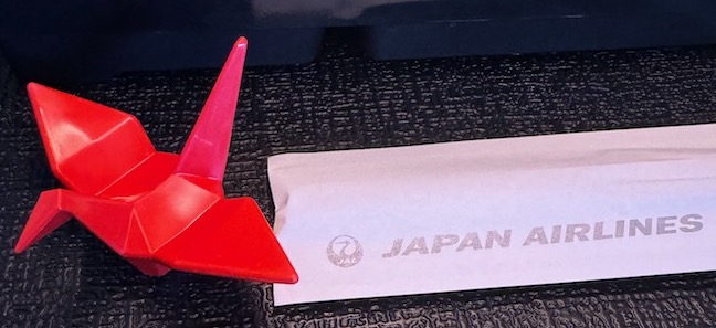 a red object next to a white envelope
