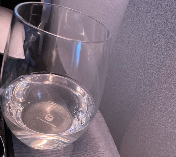 a glass of water on a chair