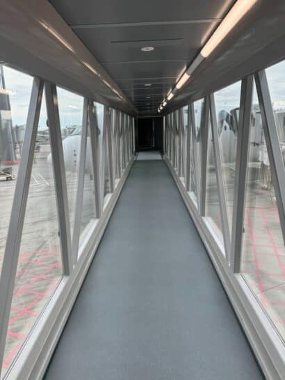 a long walkway with glass windows