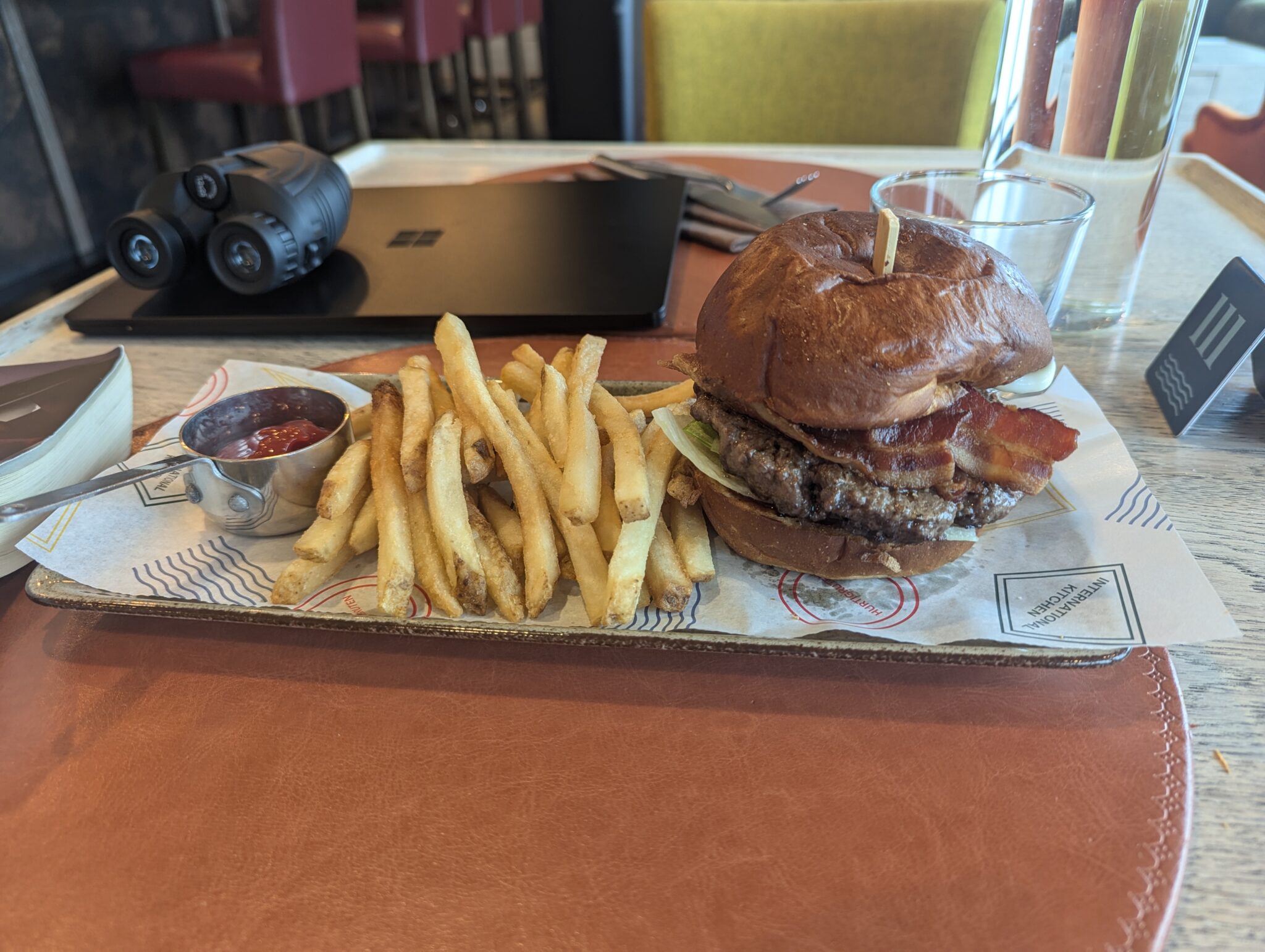 a burger and fries on a tray