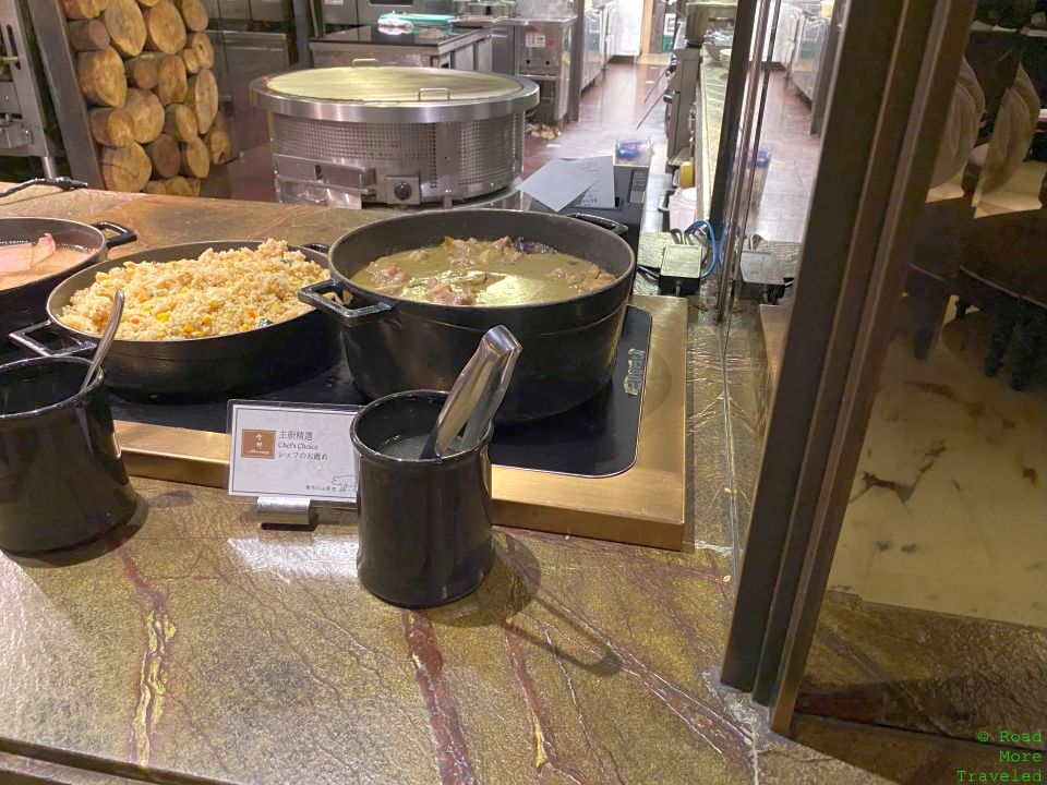 a large pans of food on a counter