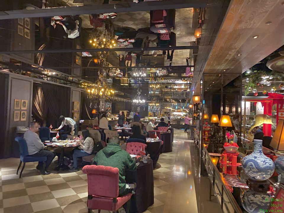 a group of people sitting at tables in a restaurant