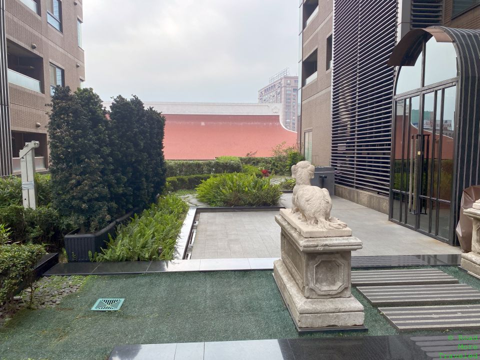 a statue of a sheep in a courtyard