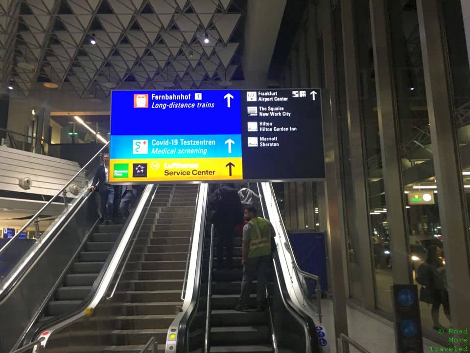 people on escalators in a building