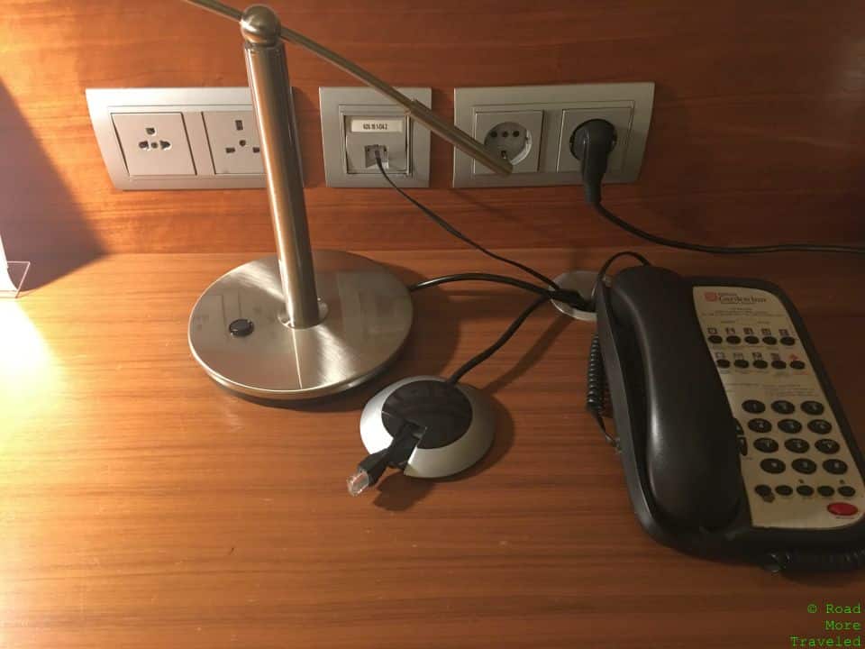 a telephone and headphones on a desk