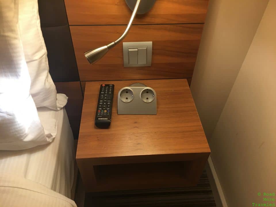 a remote control and outlet on a table