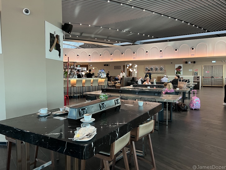 a group of people sitting at tables in a restaurant