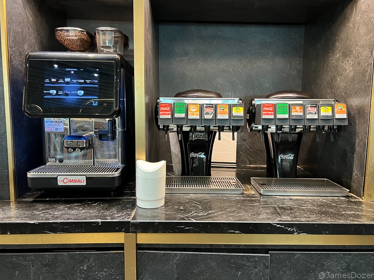 a group of soda machines on a counter