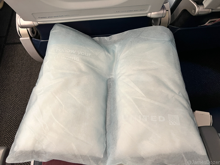 a white pillow on a seat