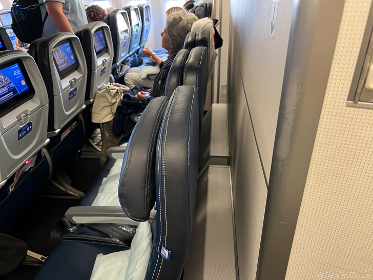 a group of people sitting in an airplane