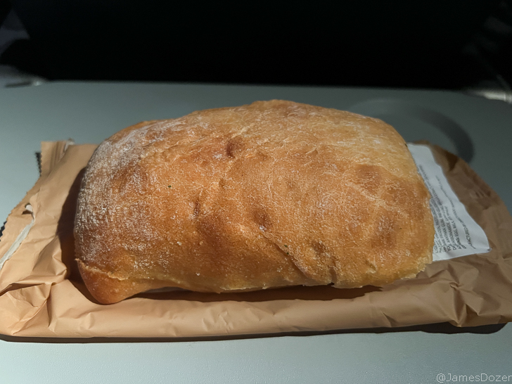 a loaf of bread on a brown paper bag