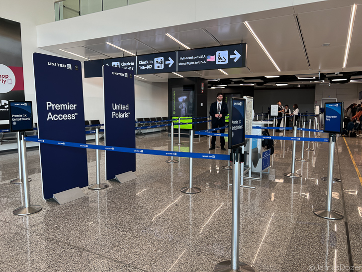 a man standing in a line in an airport