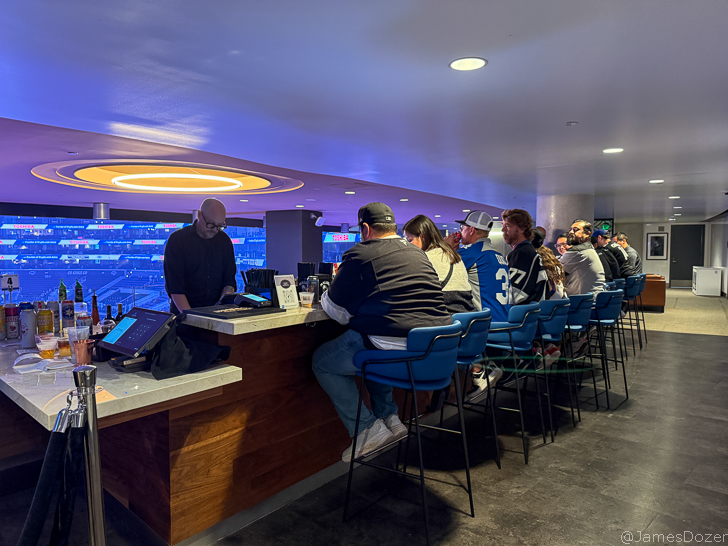 a group of people sitting at a bar