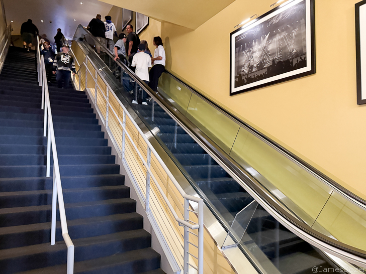 a group of people on an escalator