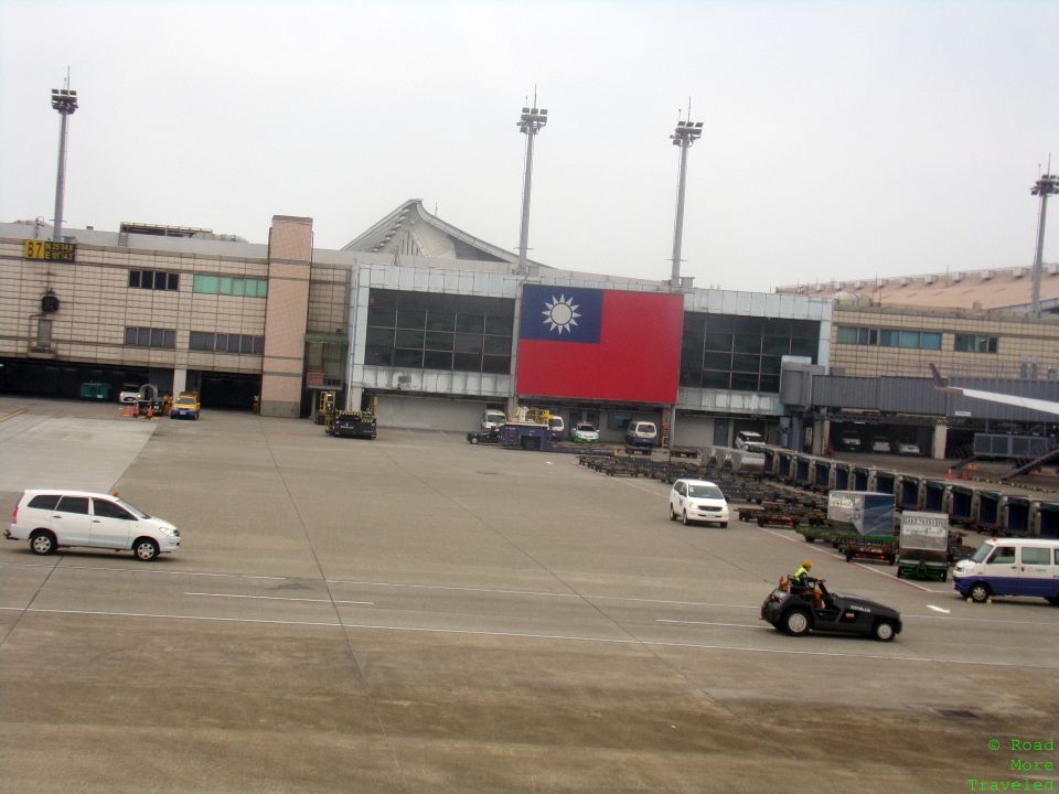 a large building with a flag in the background