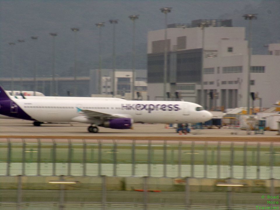 a large white airplane on a runway