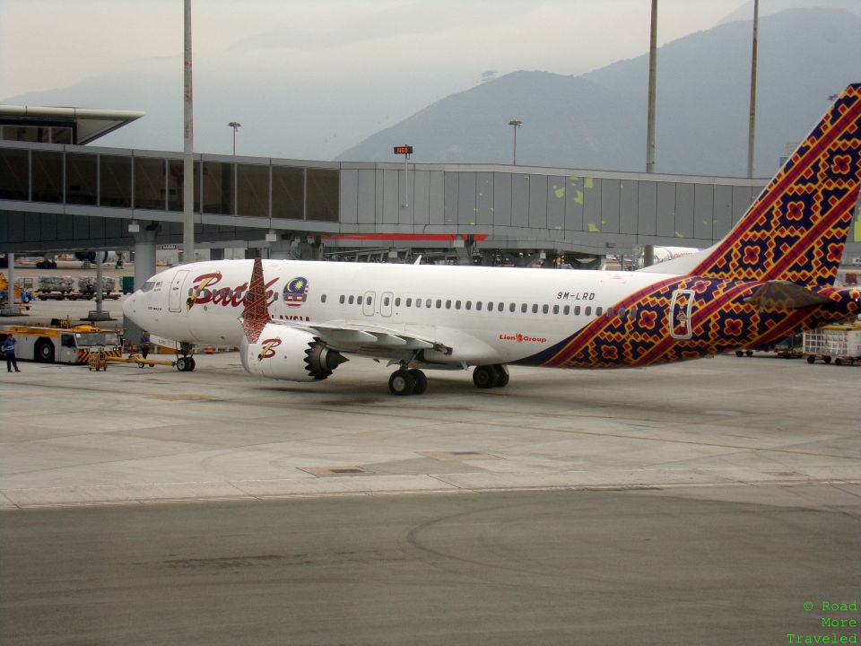 a white airplane with colorful design on it