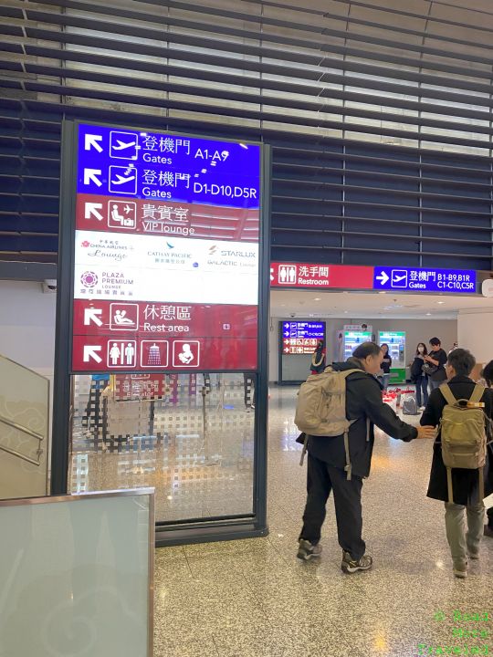 a man standing in front of a sign