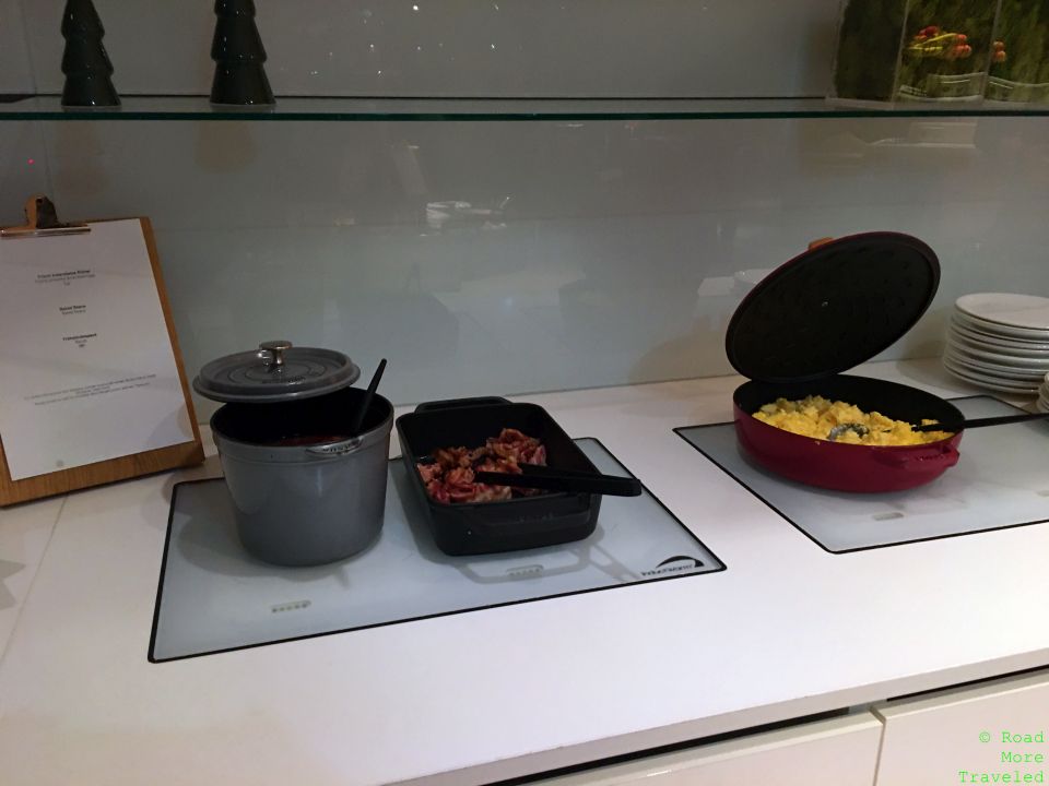 a pans and bowls of food on a counter