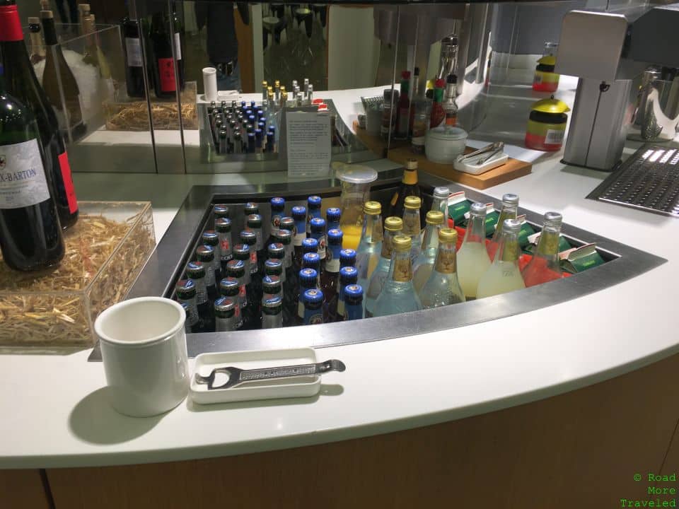 a counter with bottles and a bottle opener