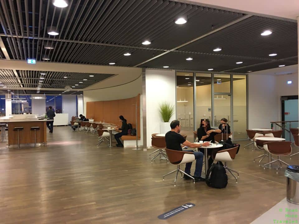 people sitting at tables in a room