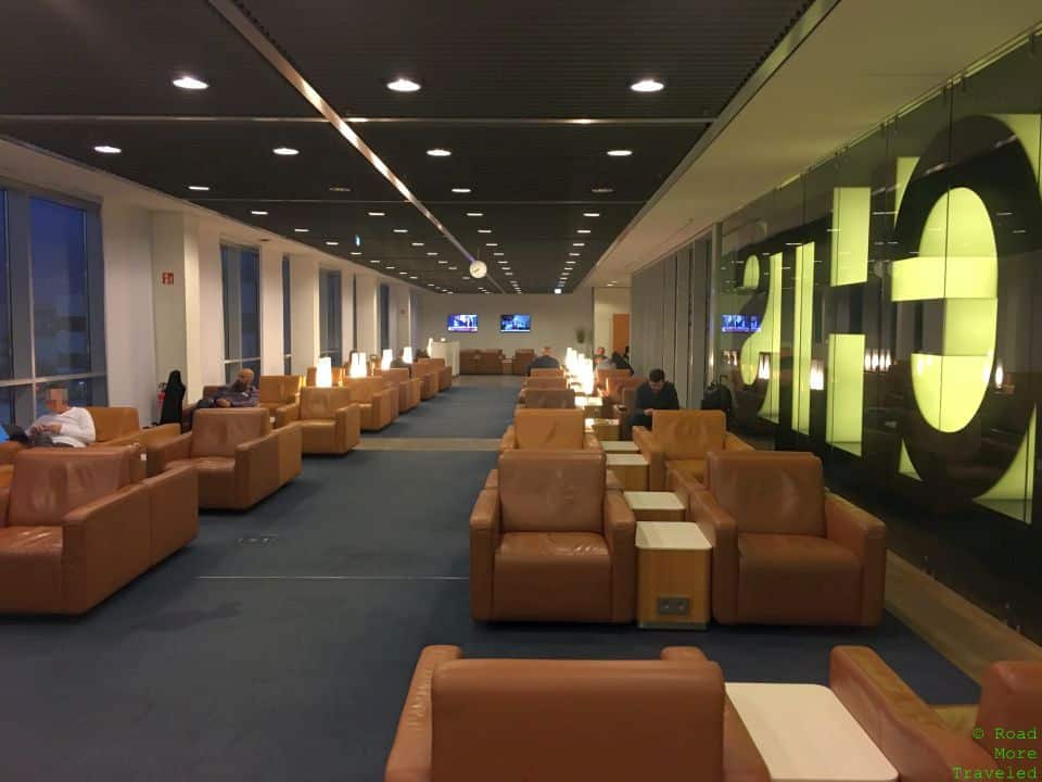 a room with many chairs and tables