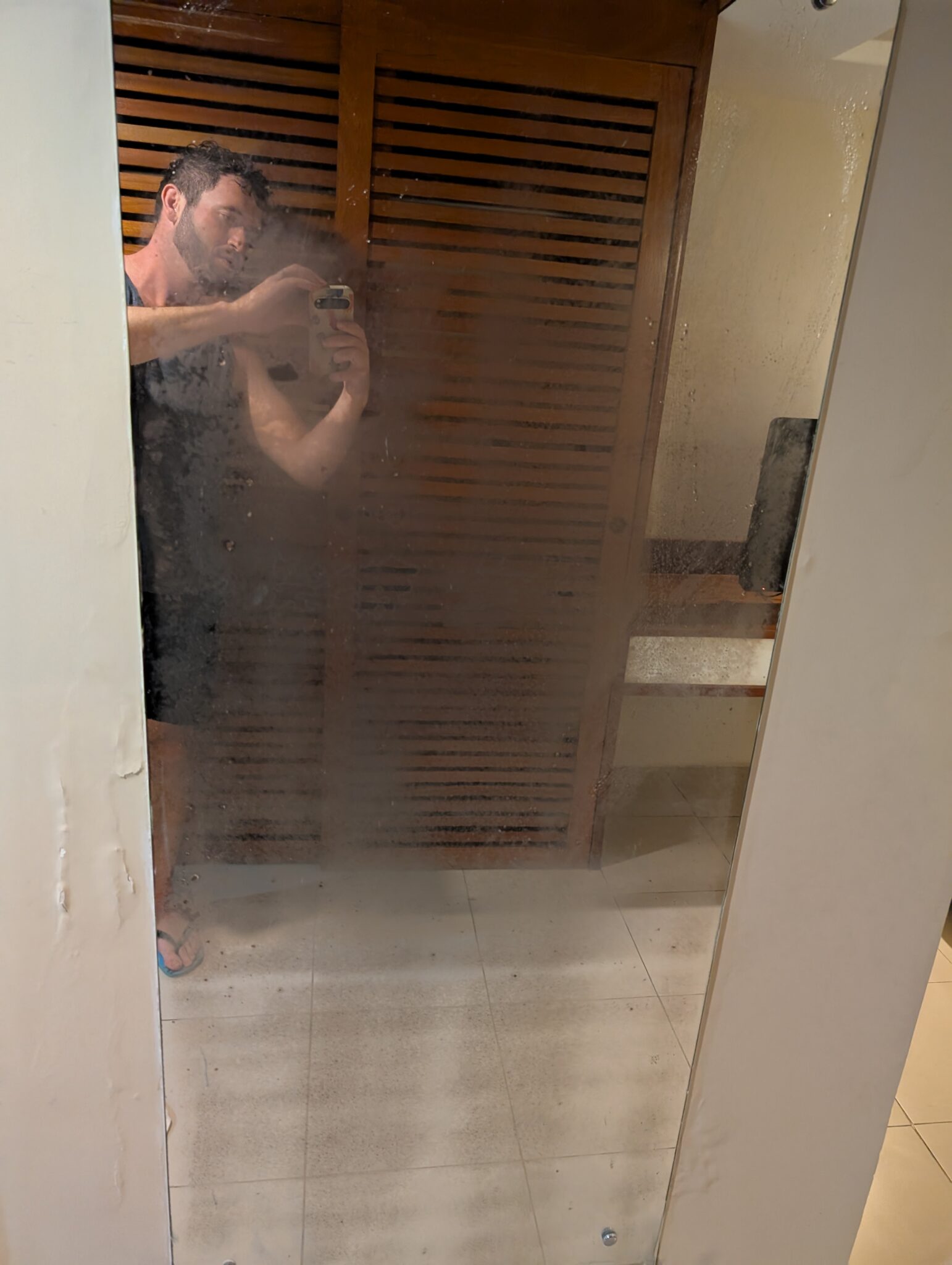 a man taking a selfie in a mirror