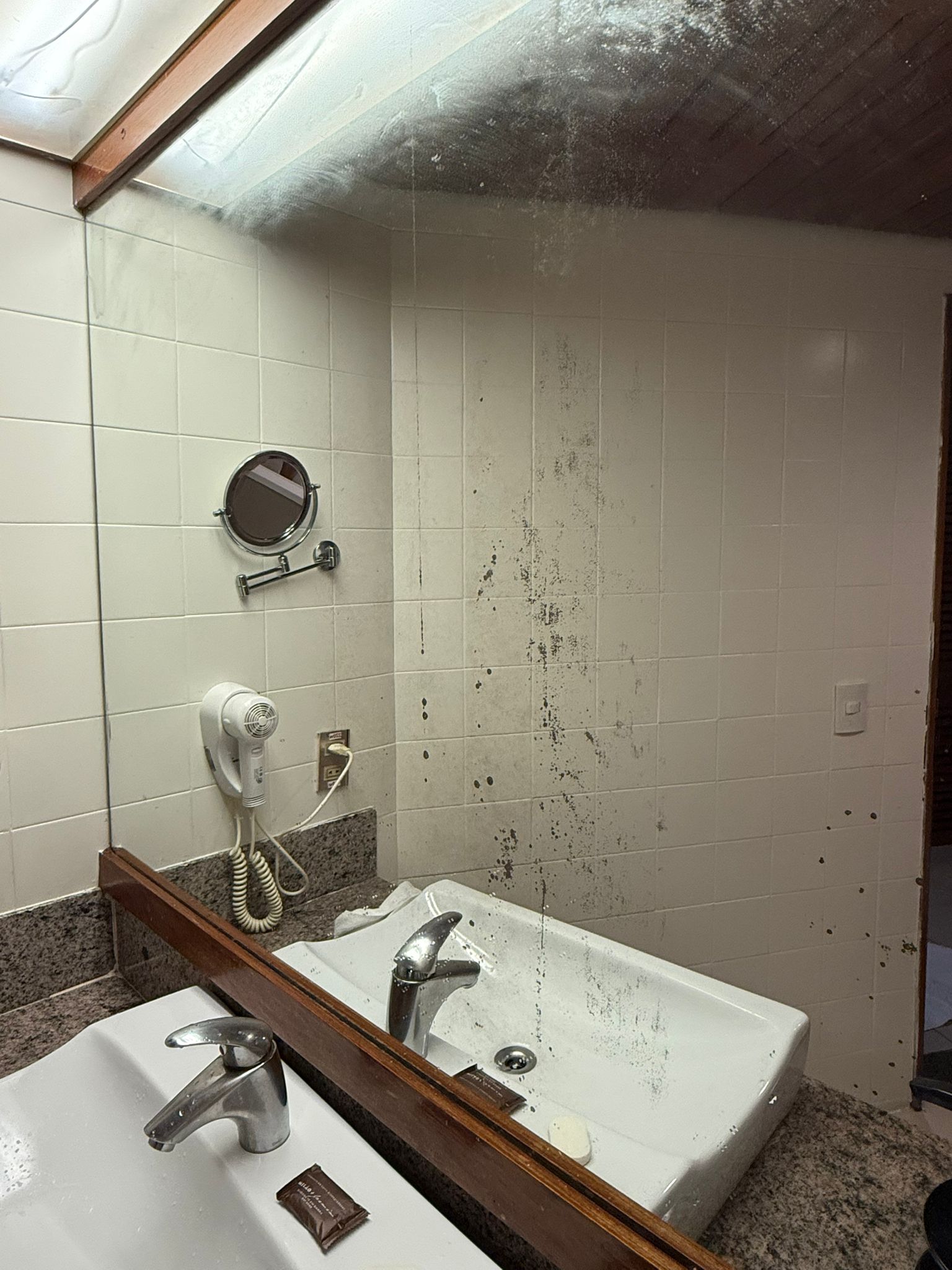 a sink and mirror in a bathroom