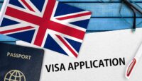 a flag and passport on a blue table