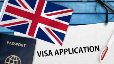 a flag and passport on a blue table