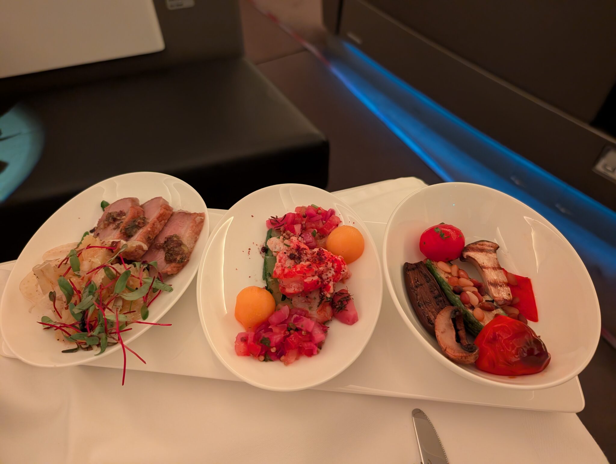 a group of plates of food on a table