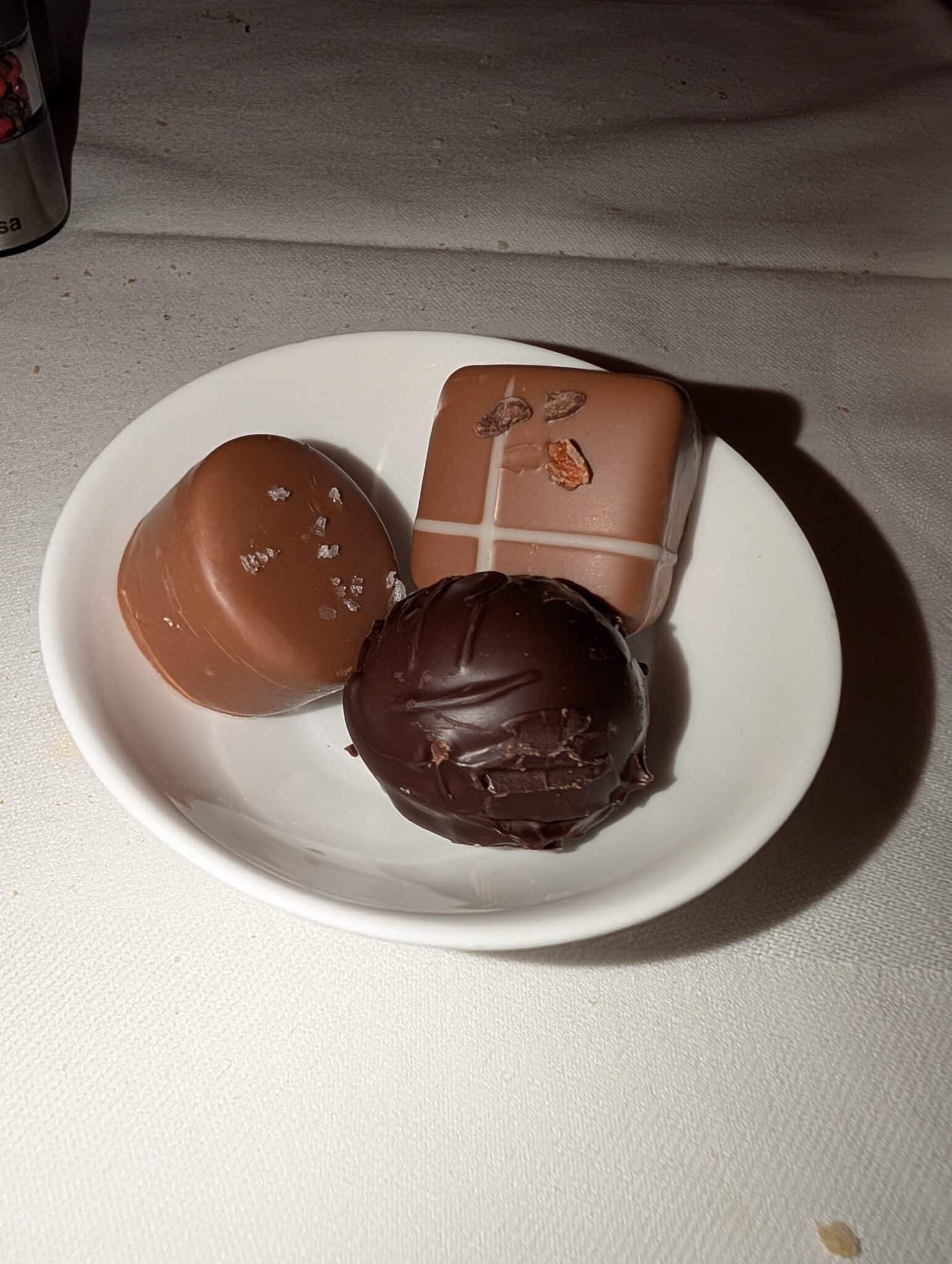 a plate of chocolate candies